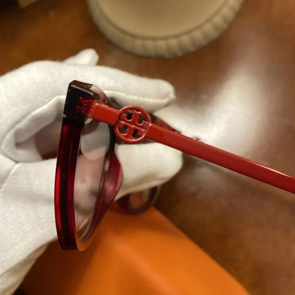 Tory Burch “Cranberry” sunglasses - New with case and dust bag.